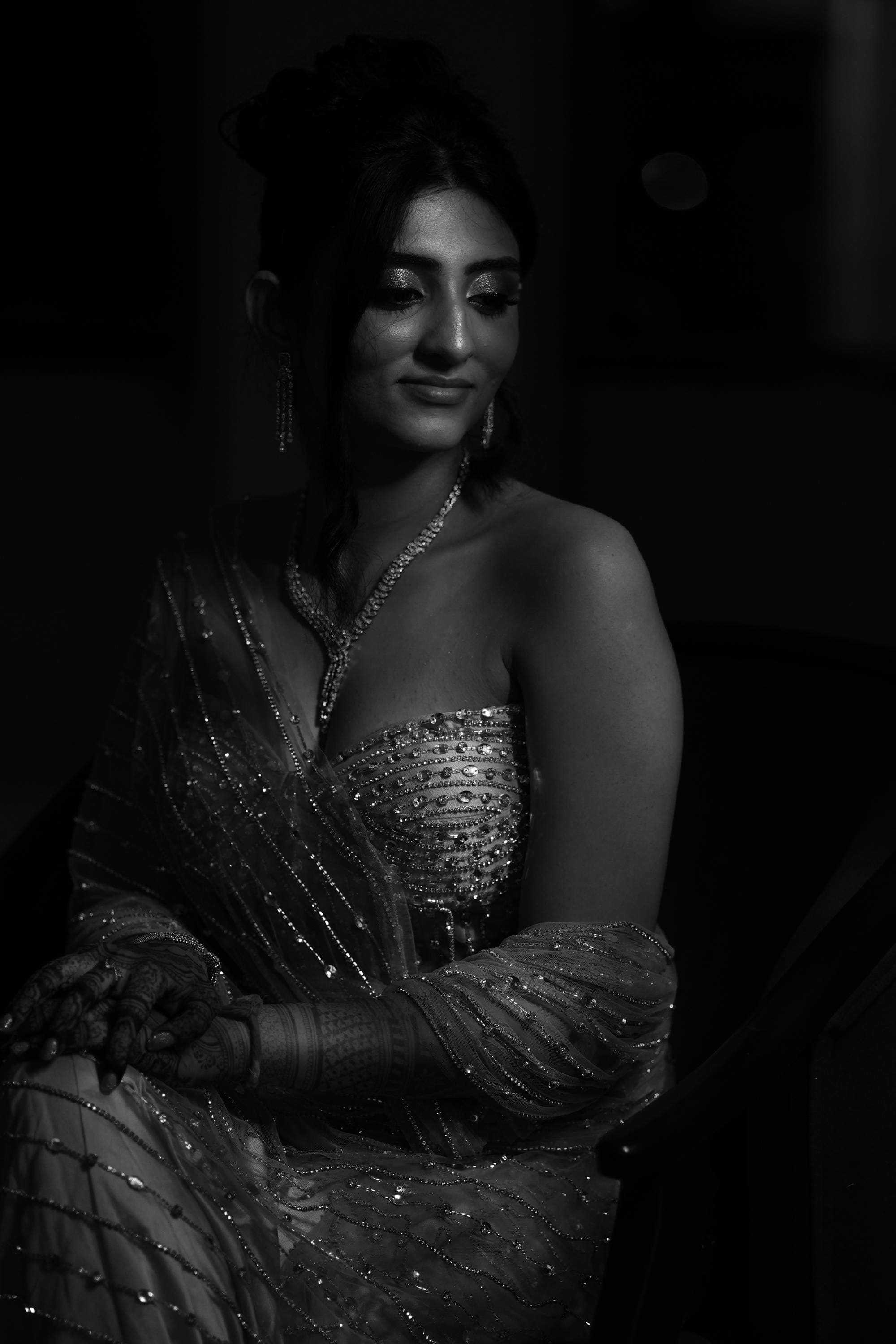 The bride in a sequinned gown, in black and white