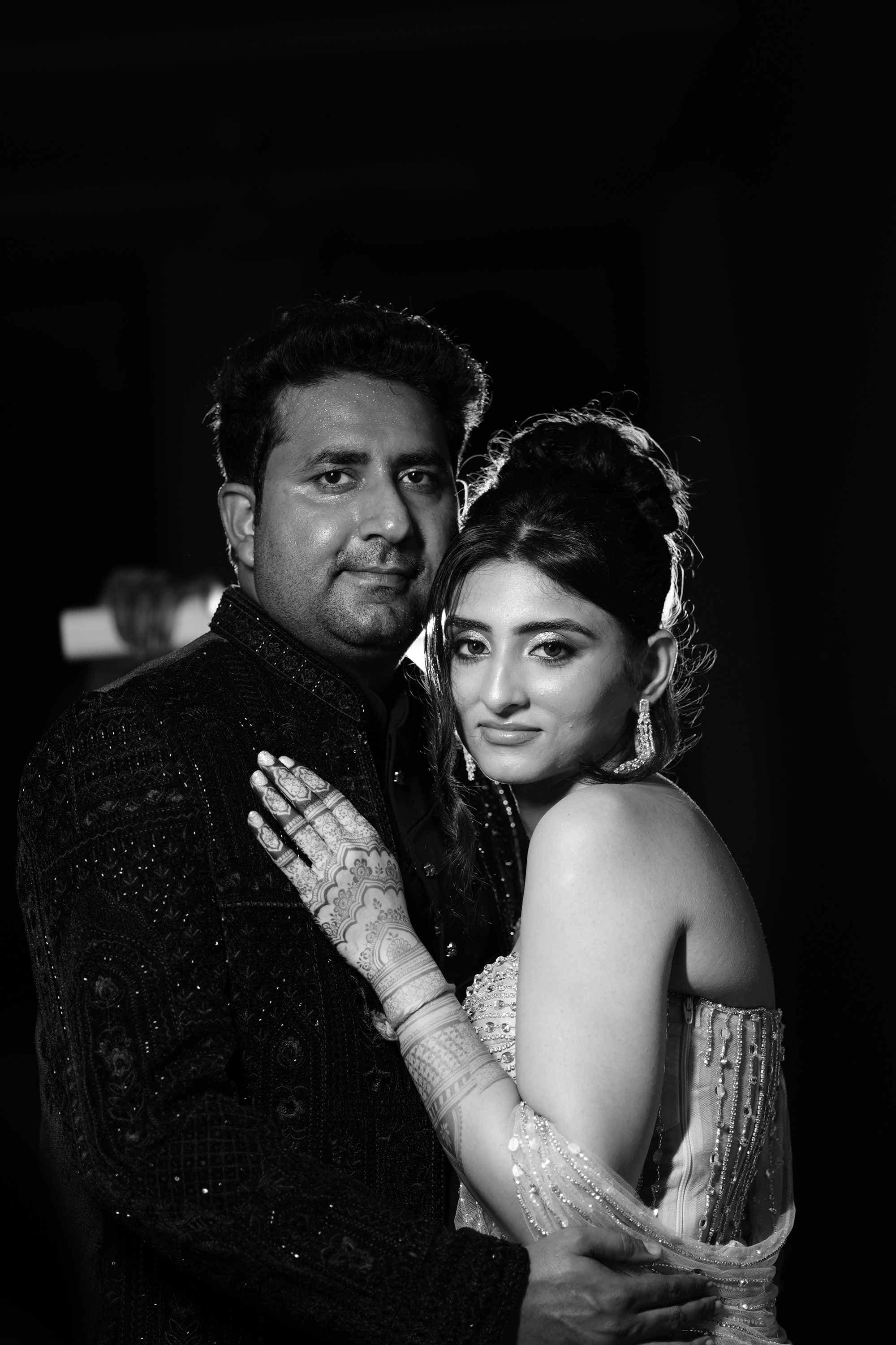 The couple in an embrace, in black and white